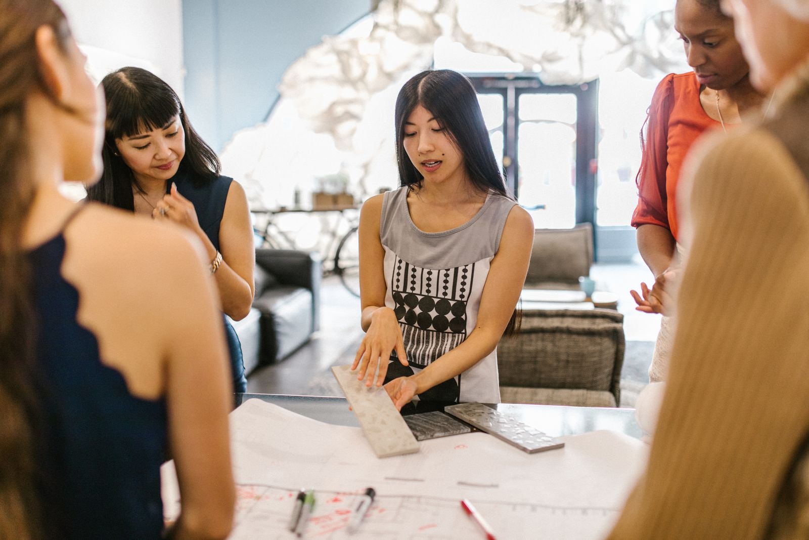 Businesswomen working together on a shared project in an office